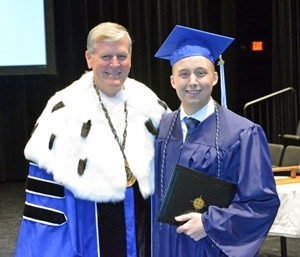 Jake Jager graduation with President Haas